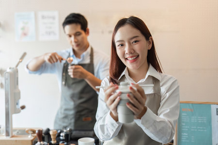 Eco-friendly Coffee Experience and Barista Creativity. A barista showcasing a sustainable coffee cup...