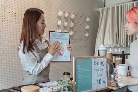 Eco-Friendly Awareness and Barista Education. A barista presenting an eco-friendly initiative to...