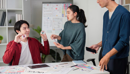 Team Collaboration and UI Design. A group brainstorming session focused on user experience and interface design.の写真素材