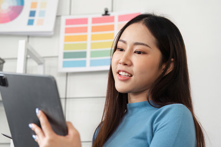 Interactive Color Application. A designer engaging with digital tools to finalize color choices.の写真素材