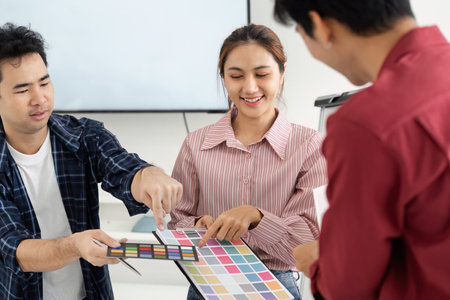 Color Selection and Creativity. Team discussing color palettes for a project.
