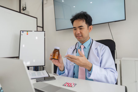 Digital Health Consultation and Medication Compliance. A healthcare professional reviews medication during a virtual appointment.の写真素材