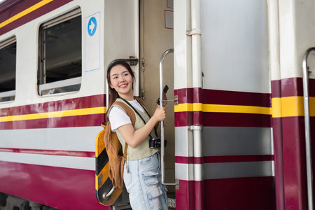 Travel Journey and Boarding Experience. A woman joyfully preparing to board a train, full of...