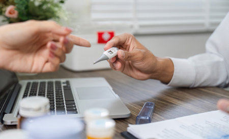 Health Monitoring Discussion. A doctor interacts with a patient about health metrics using a...