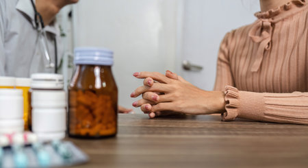 Patient Dialogue and Medication Discussion. A patient discussing her health condition and medication options with a healthcare provider.の写真素材