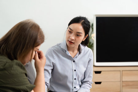 Empathy and Therapy. A psychiatrist provides a safe space for a client expressing emotions during a session.の写真素材