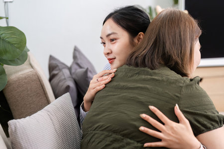 Emotional Support and Therapy. A compassionate hug between a therapist and a client during a...