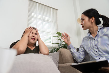 Therapy and Emotional Support. A psychiatrist guiding a distressed patient during a therapy session,...