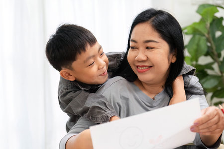 Back to School and Family Bonding. A joyful moment between a mother and her son as they share...
