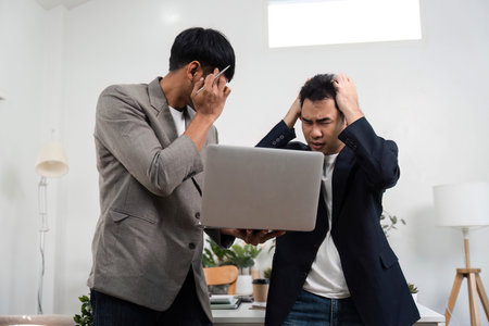 Emotional Communication and Conflict Management. Two professionals navigating a tense conversation...