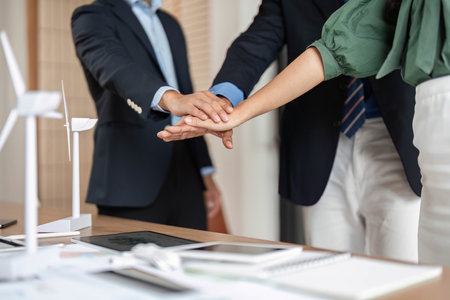 ESG and Sustainability: Close-up of hands symbolizing teamwork and partnership