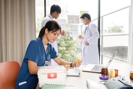 Doctor analyzing patient medication and health data in a meetingの写真素材