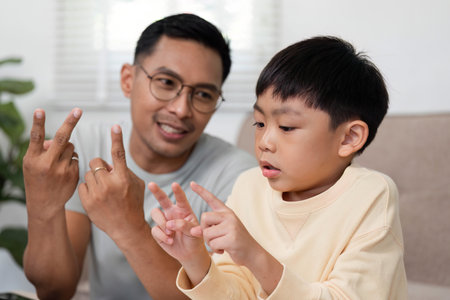 Homeschool activity with father showing math problems to son