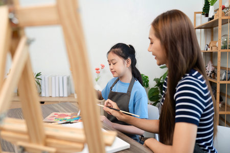 Participatory Art Session: Girl and Woman Painting Togetherの写真素材