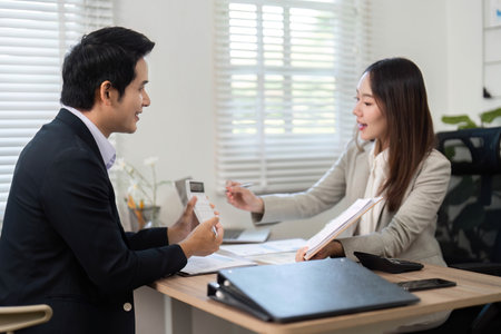 Financial Consultation. Professional meeting between financial advisor and client discussing investment strategies.の写真素材