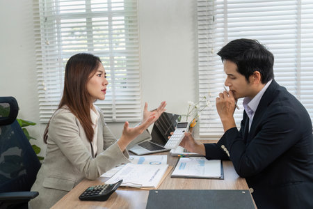 Financial Consultation. Engaging discussion between a financial advisor and client in a modern office.の写真素材