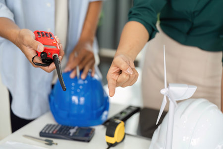 Workplace Safety and Measurement. Professionals using tools for project planning.の写真素材