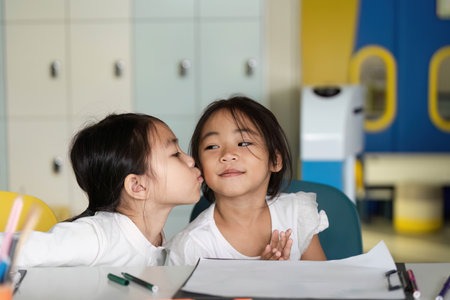 Back to School: Affectionate Moment Between Two Young Girls