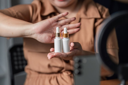 Skincare influencer showcasing premium facial serums during a live stream in her home studio