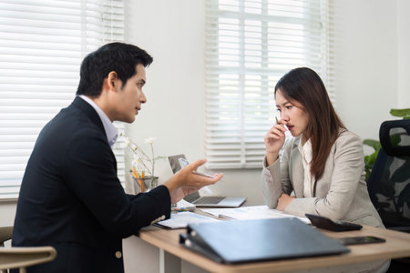 Financial Consultation. Professional discussion between a financial advisor and a client in an office.の写真素材
