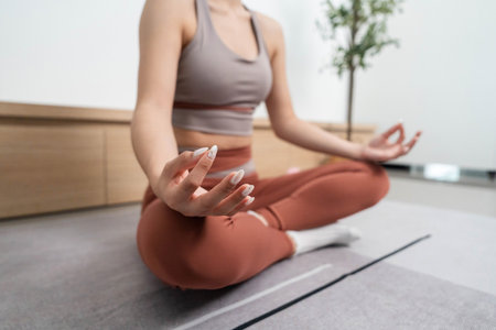 Yoga and Meditation. Woman in a meditative pose, practicing mindfulness and relaxation.の写真素材