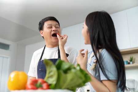 Healthy Cooking Together: Couple Preparing Fresh Vegetables in Modern Kitchenの写真素材