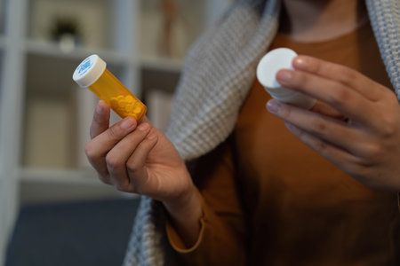 Medication Management. Individual holding prescription bottle and cap.