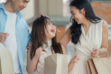 Family shopping day urban mall candid moments bright atmosphere joyful interaction togetherness conceptの写真素材