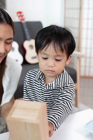 Child exploring creativity with mother in a playful settingの写真素材