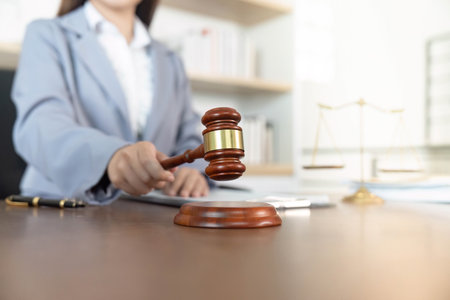 Legal Profession. Lawyer using gavel in office for justice and decision-making.