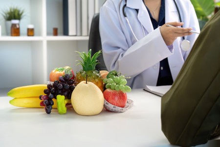 Nutrition Counseling. Doctor discussing healthy food options with patient.の写真素材