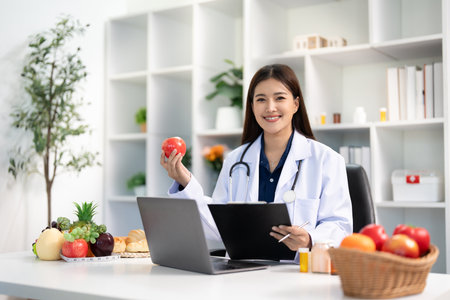 Nutrition and Wellness. Dietitian showcasing healthy food options to a patient.の写真素材
