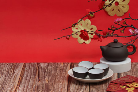 Elegant Tea Set and Red Envelopes for New Year Celebrationの写真素材