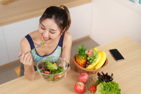 Enjoying a Healthy Salad: Fresh Ingredients and Wellnessの写真素材