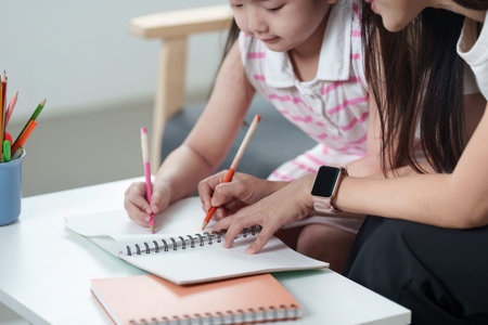 Creative learning Mother and daughter drawing together