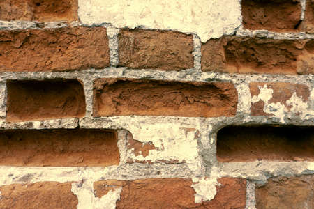 texture of dilapidated red brickwork for backgroundの写真素材