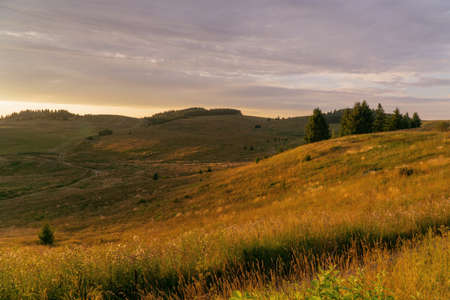 sunset over hilly fields in summer in Bashkiria