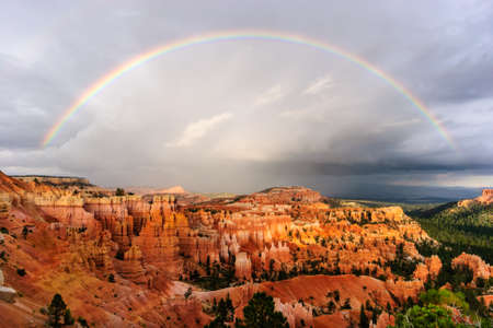 sunset rainbow over bryce canyonの写真素材