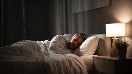 Male figure is resting comfortably in a well-decorated bedroom with warm lightの素材