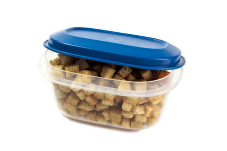 croutons in plastic food container with open cover isolated on white backgroundの写真素材