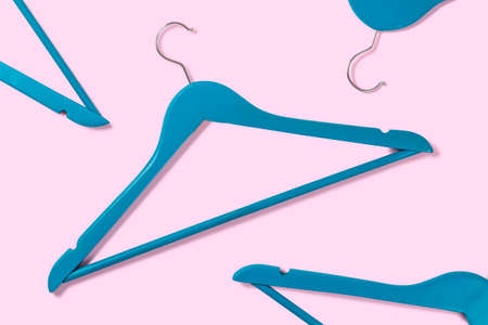 Top view on blue clothes hangers on pastel backgroundの写真素材