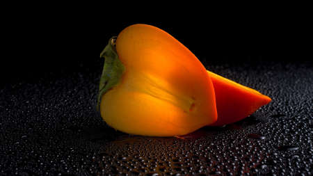 delicious persimmon fruit lies on the tableの写真素材