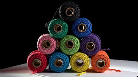 multicolored spools of thread on the tableの写真素材