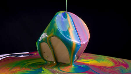 multicolored liquid on a wooden square