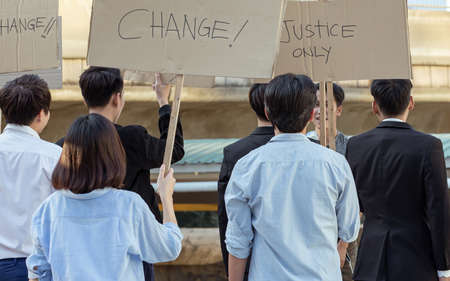 Protesters holding signs of change and justice. They fignt for human rightの写真素材