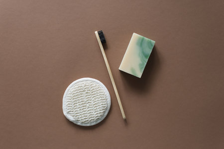 Top view of bathroom tools and organic cosmetic products on brown background emphasizing natural, eco-friendly beauty essentials and self-care routine concept. Natural skincareの写真素材