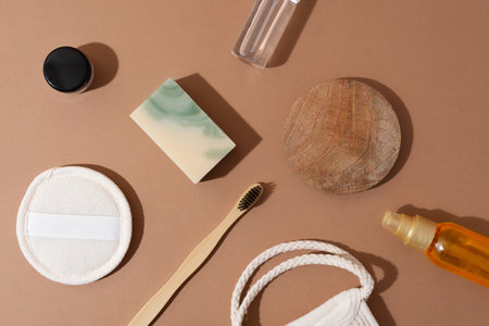 Top view of bathroom tools and organic cosmetic products on beige background emphasizing natural, eco-friendly beauty essentials and self-care routine concept. Natural skincareの写真素材