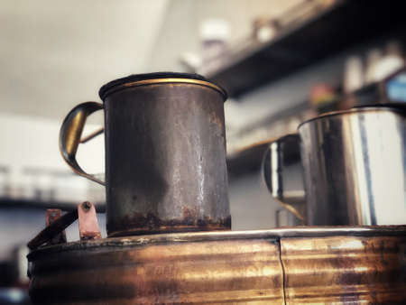 Boiling water in a hot pot at coffee shop.