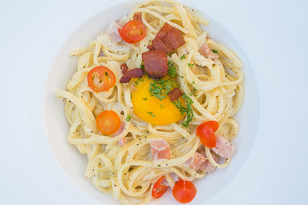 Close-Up Spaghetti Carbonara On White Dishの写真素材