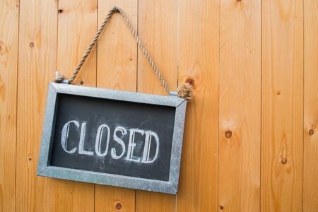 Closed Sign Hang On Wood Doorの写真素材